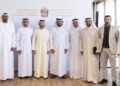 UAE Ministry of Industry and Advanced Technology officials and food industry leaders meeting at Mleiha Wheat Farm to discuss AI-powered government services for the food sector.