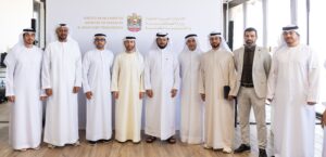 UAE Ministry of Industry and Advanced Technology officials and food industry leaders meeting at Mleiha Wheat Farm to discuss AI-powered government services for the food sector.